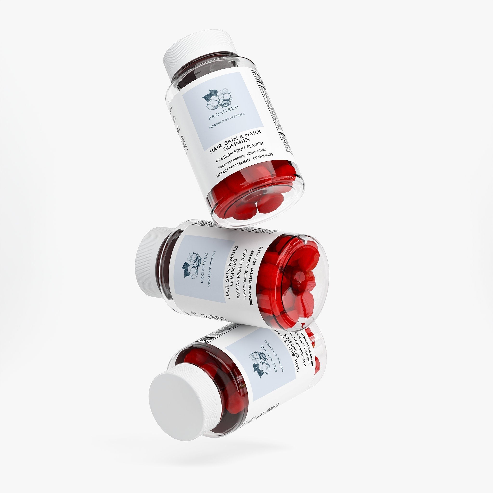 Promised Hair, Skin & Nails Gummies in three stacked bottles with red passion fruit flavored supplements