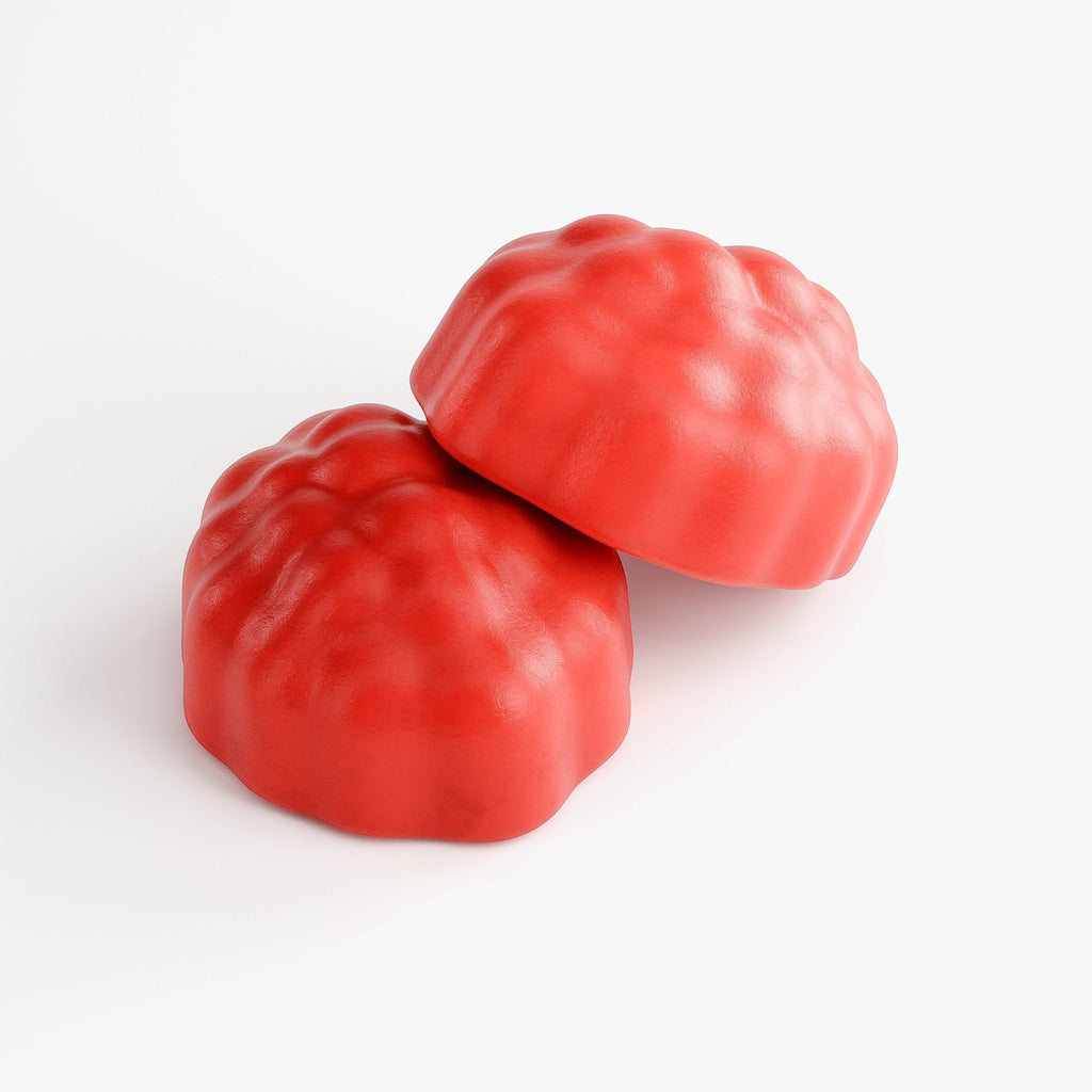 Two red Promised Hair, Skin & Nails supplement gummies with a textured, berry-like shape on a white background.